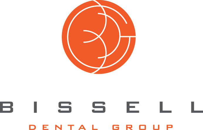 The image features a logo with the word  BISSELL  prominently displayed above an illustration of a stylized mouth, which appears to be a graphical representation of a smile or a dental care service. Below the main graphic, there is additional text that reads  DENTAL GROUP.  The color scheme consists of red, white, and black, with the logo set against a light background.